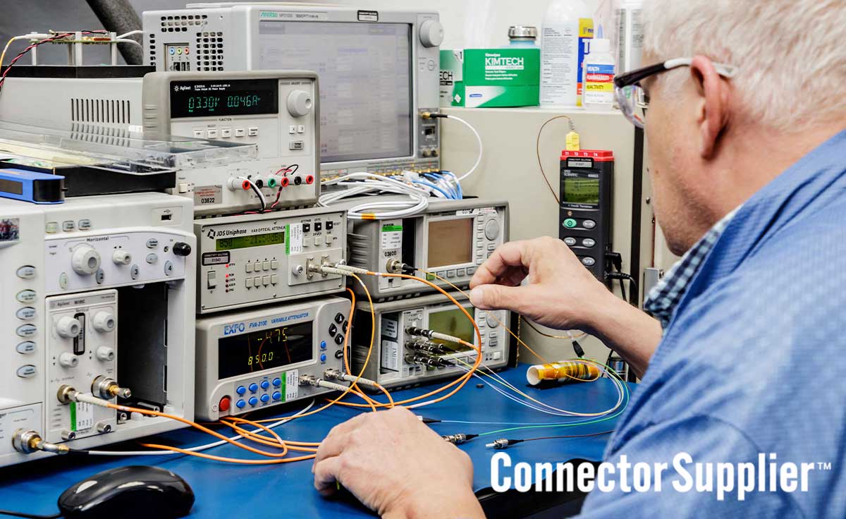 Electrical Engineer checking components at a work table